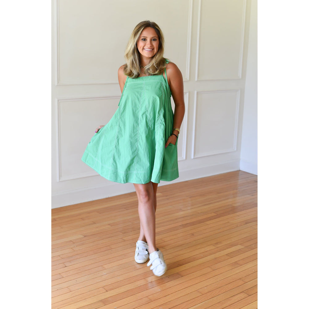 green dress with white stiching