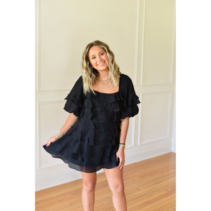 black mini dress with ruffles