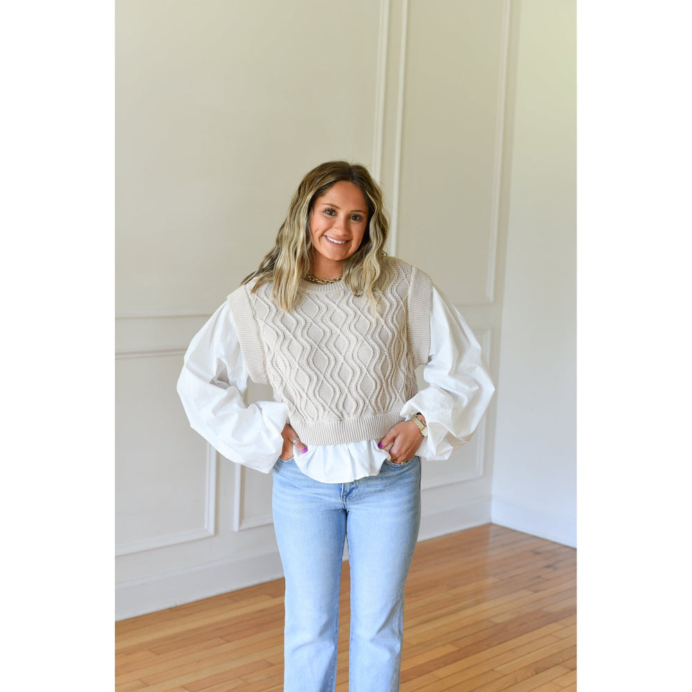 cream sweater over white top